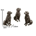 Tres soportes de perro sentado con diagrama de medidas.